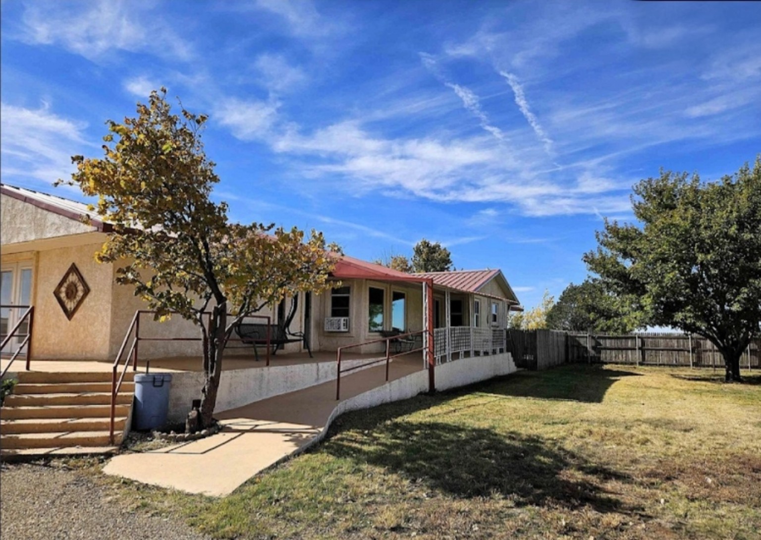 Home exterior, lawn and covered porch